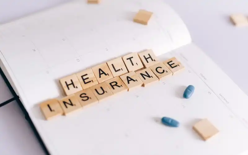 Which private health insurers are delaying premium increases in 2023?